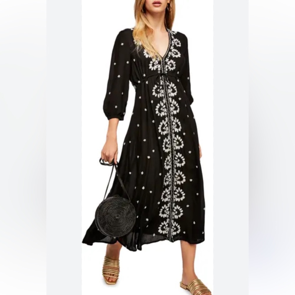 Free People Embroidered Fable midi dress in black with white floral embroidery.